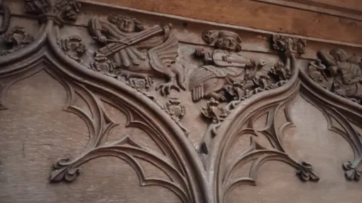 Hybrid creatures with music instruments, wooden carving on the choir stalls, Basel cathedral