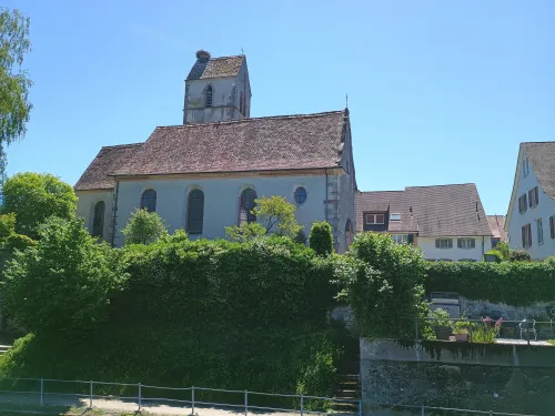 Church with storks nest, Kaiseraugst, viewed from the Rhine